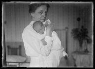 Female nurse holding an infant